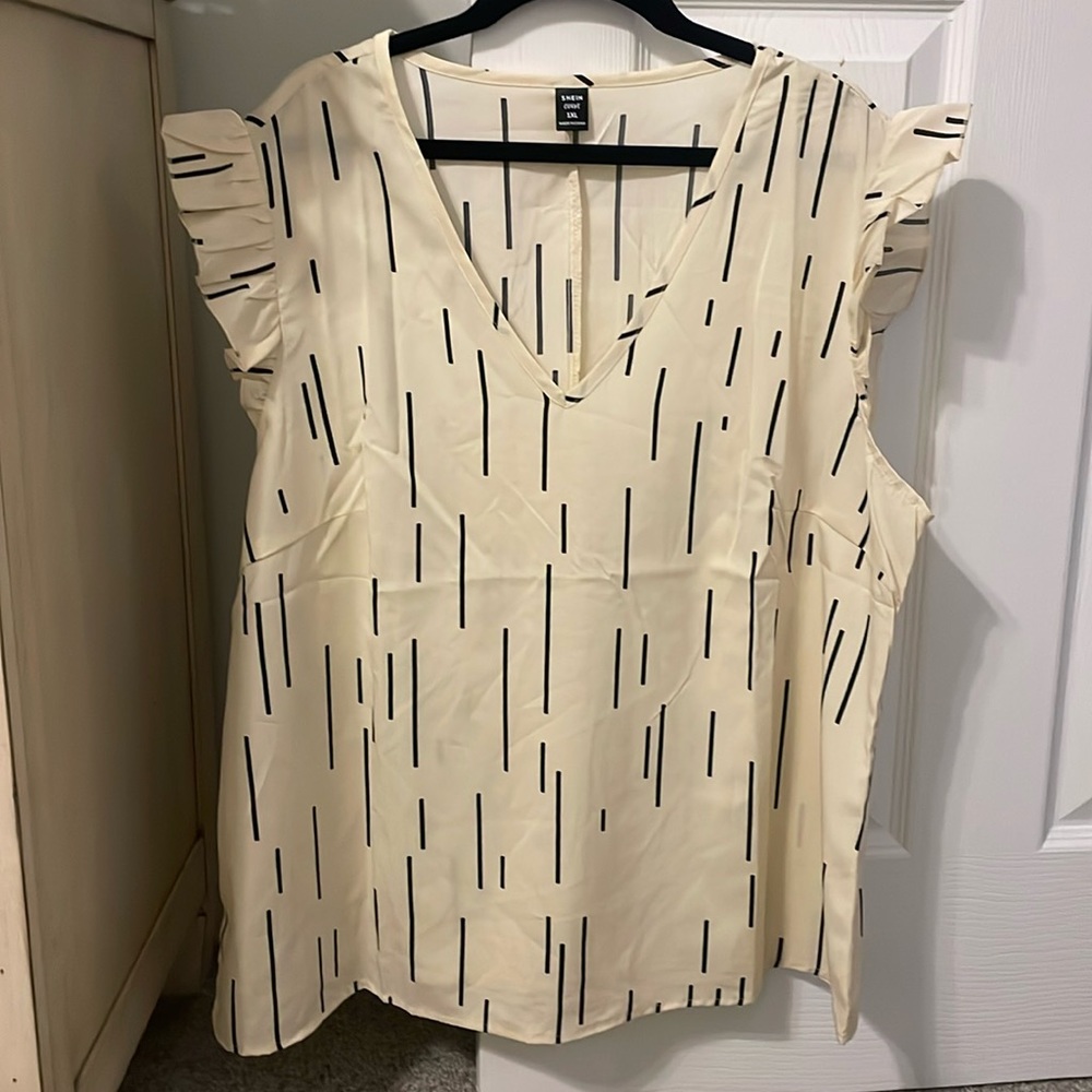 Cream colored shirt with ruffled sleeve never worn